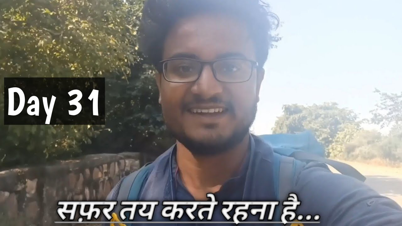 Pradeep Bhatt walking through the vibrant streets of Jhalrapatan, Rajasthan, with ancient architecture in the background, on Day 31 of his solo journey from Kashmir to Kanyakumari for Deep Walks Deep Talks.