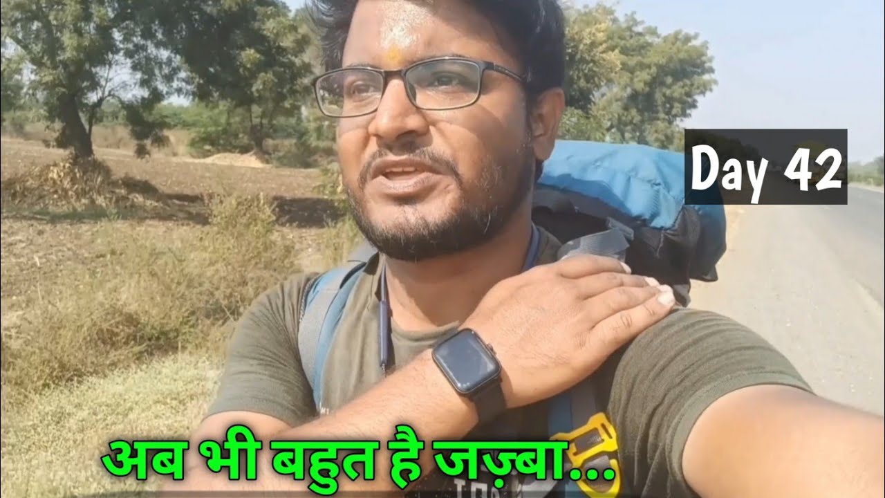 Pradeep Bhatt walking along a scenic road from Shirpur to Dhule, Maharashtra, surrounded by lush landscapes, symbolizing the theme 'Deep Walks Deep Talks.'