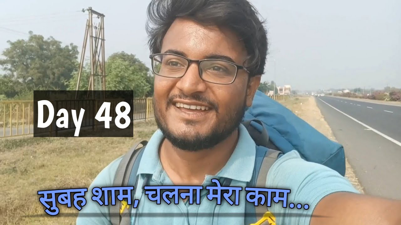 A scenic view capturing the essence of Maharashtra during the "Deep Walks Deep Talks - Day 48" journey from Gevrai to Beed, showcasing vibrant fields under the golden sunlight with a lone traveler walking along a rural path, reflecting the spirit of solo travel and exploration.